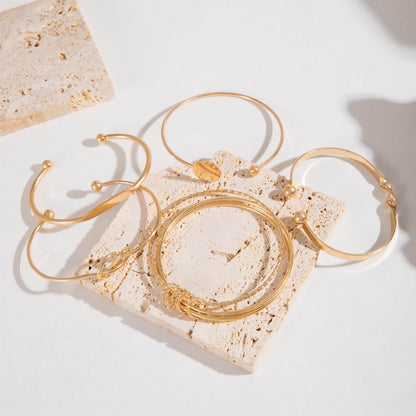 Amelise | Vrouwen minimalistische armbanden set met glanzende geometrie | Goud